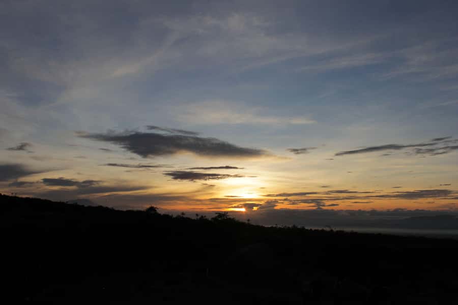 Merapi volcano sunrise with 4wd jeep and step on cold lava - The river crossing: water, spray, and the feeling of place